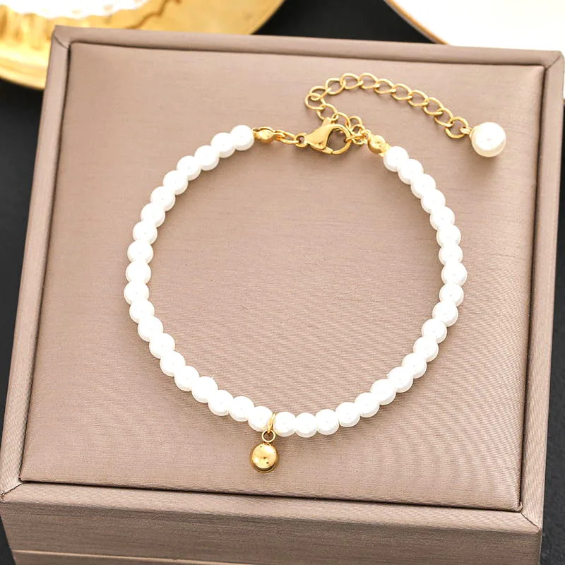 Pulsera perlas y corazón